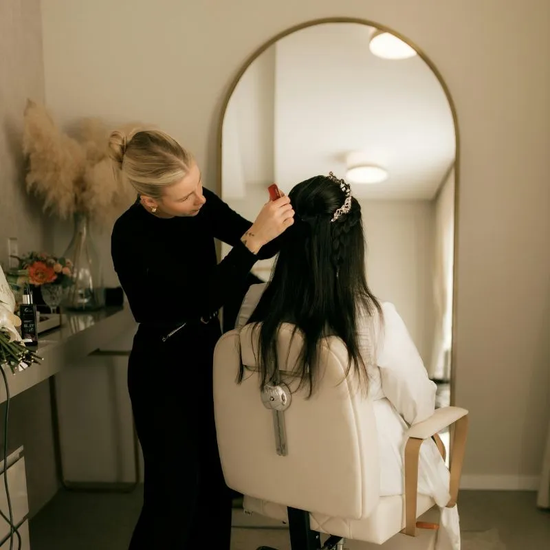 Professional hairstylist providing organic hair treatment